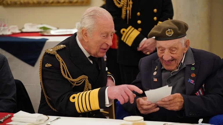 King Charles III speaks to Second World War veteran Joe Mines at a tea party in Buckingham Palace, central London, following the military procession to mark the 80th anniversary of VE Day. Picture date: Monday May 5, 2025.
