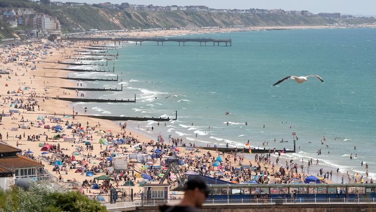 People enjoy the warm weather on Bournemouth beach in Dorset on Sunday. Pic: PA