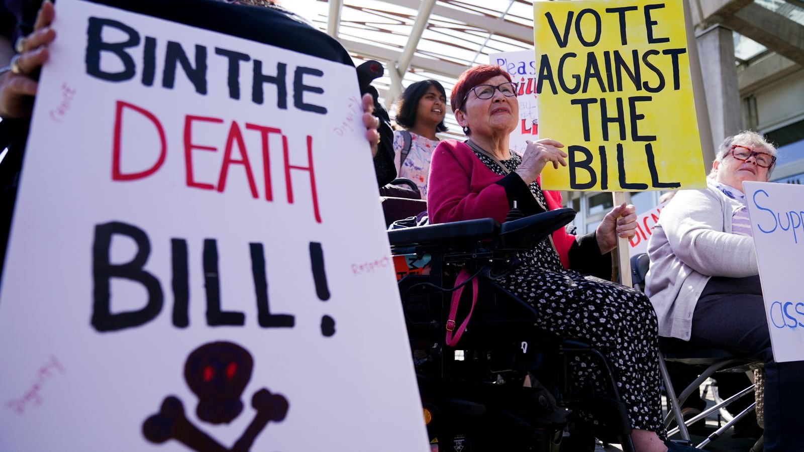 Protesters from the Glasgow Disability Alliance demonstrating outside the Scottish Parliament in Edinburgh, ahead of the debate and vote on the Assisted Dying for Terminally Ill Adults (Scotland) Bill later today. Picture date: Tuesday May 13, 2025. PA Photo. See PA story POLITICS AssistedDying. Photo credit should read: Andrew Milligan/PA Wire
