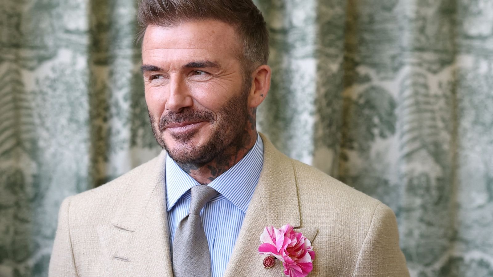 David Beckham in a suit at Chelsea Flower Show. Pic: Reuters