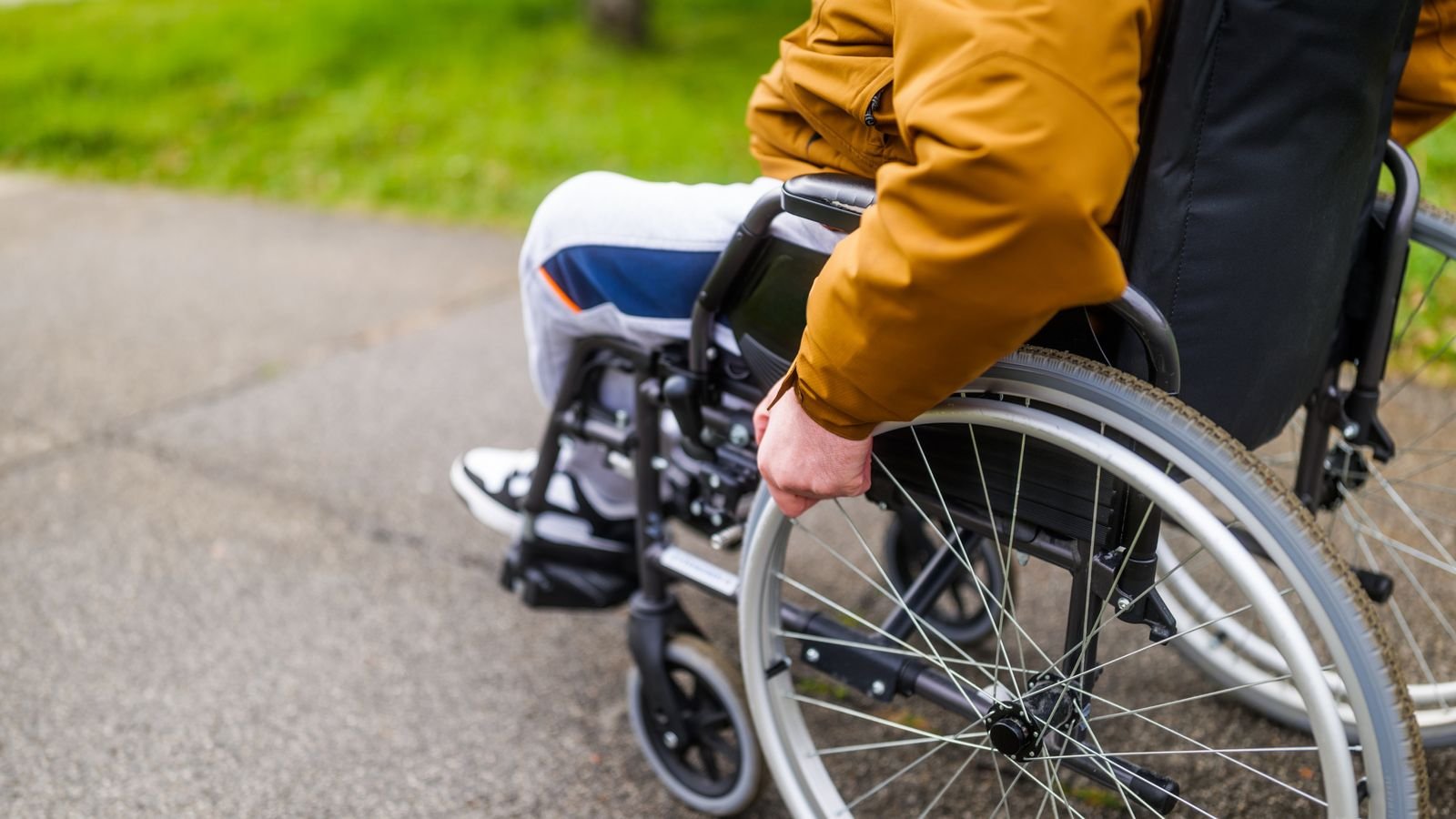 man in a wheelchair in park