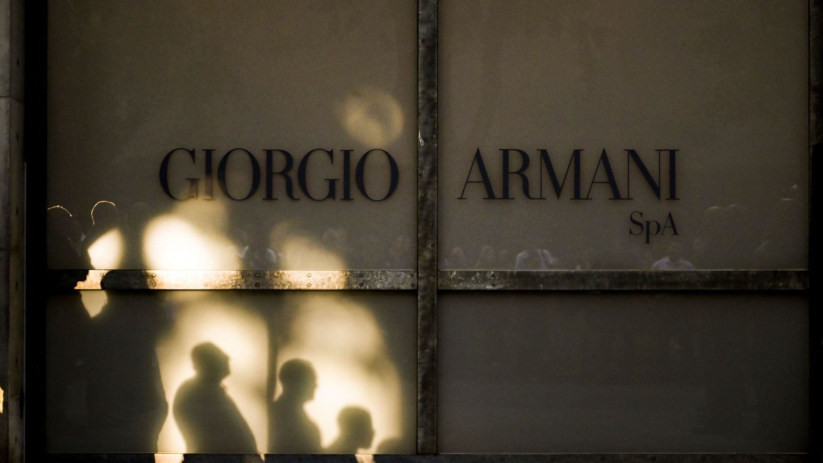 Mourners wait for Giorgio Armani