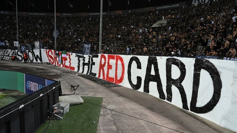Fans of Greek side PAOK display a banner that reads 'Show Israel the red card' at a match against Maccabi Tel Aviv. Pic: AP