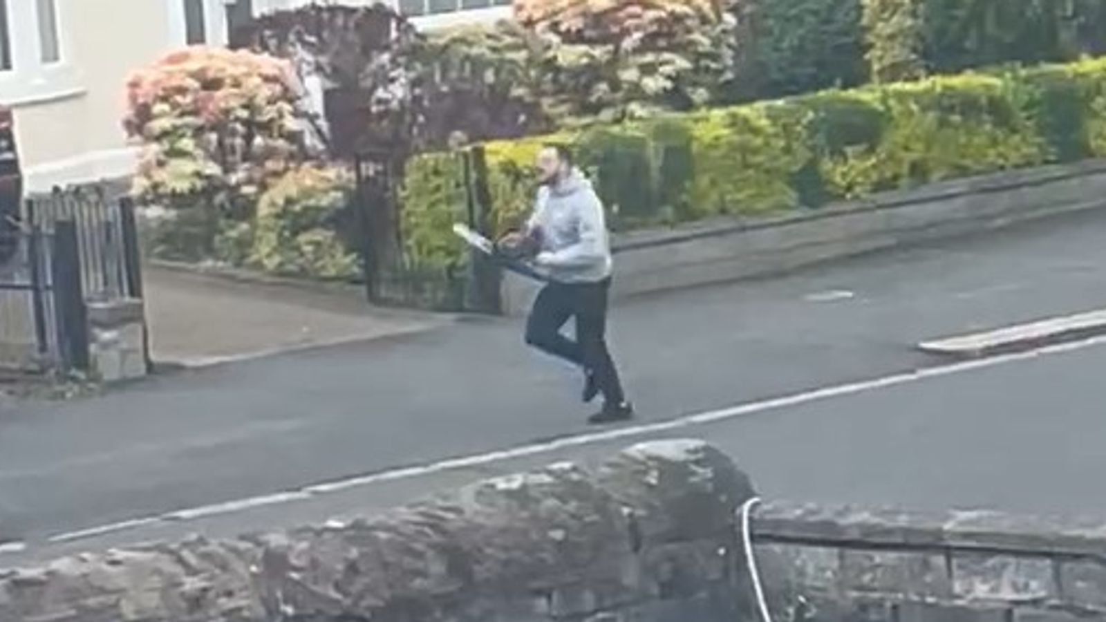Liridon Kastrati chasing after PC Gary Cowan with a chainsaw. Pic: Crown Office