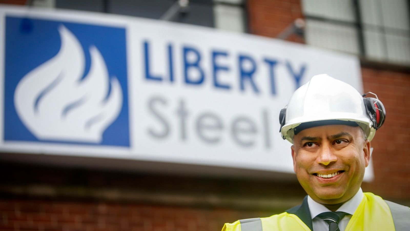 Sanjeev Gupta in front of a Liberty Steel sign. File pic: PA