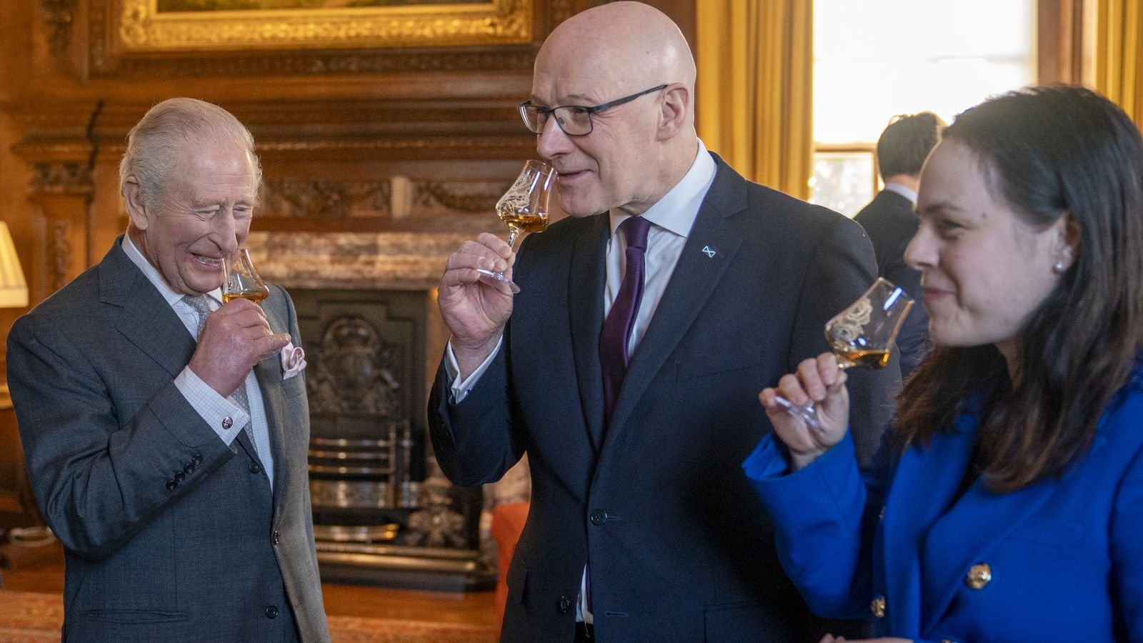 King Charles, First Minister John Swinney and Deputy First Minister Kate Forbes enjoying a dram. Pic: PA