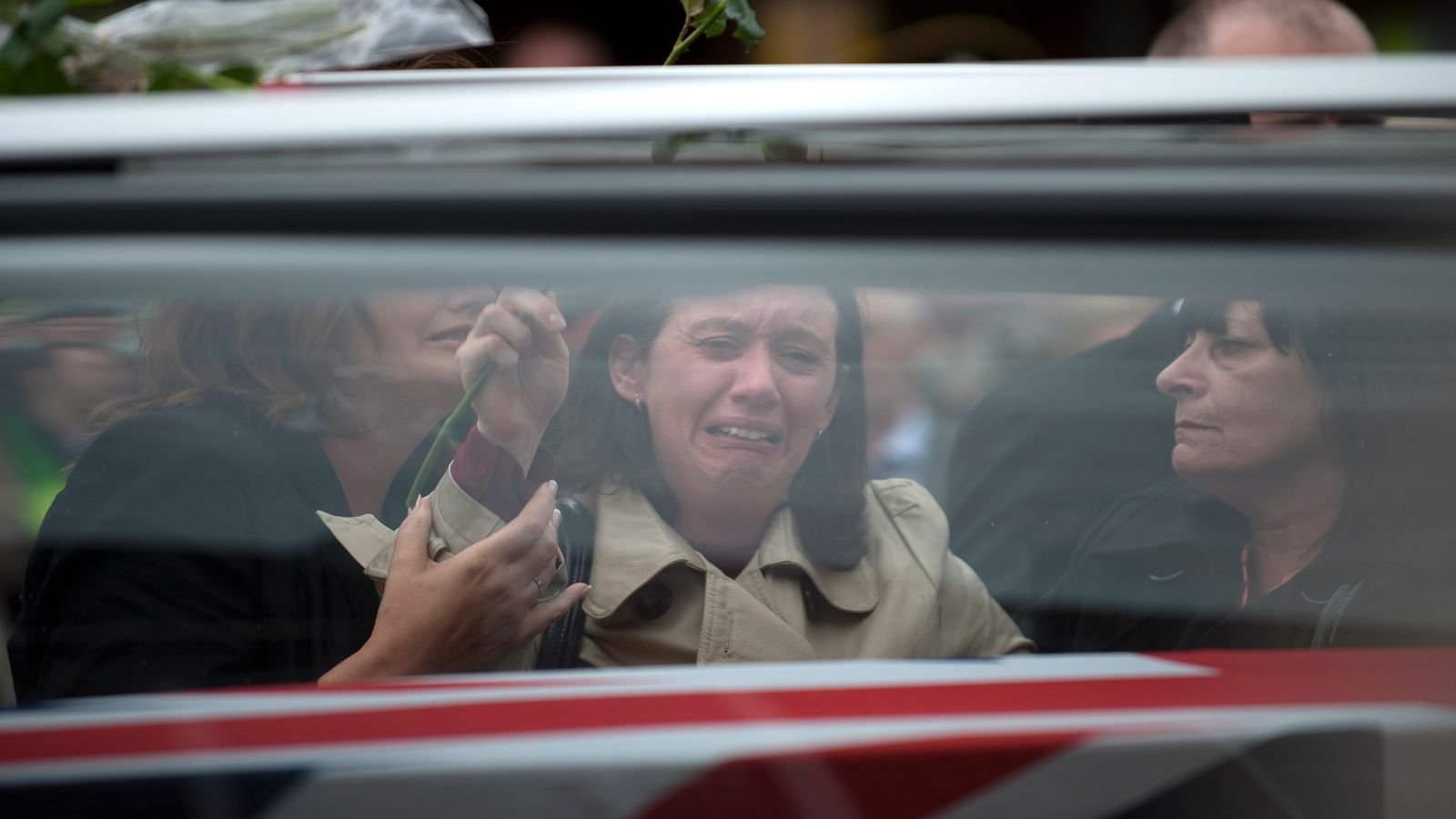 Mourners grieve as Private Gareth Bellingham and Craftsman Andrew Found are repatriated through Wootton Bassett. Pic: Reuters