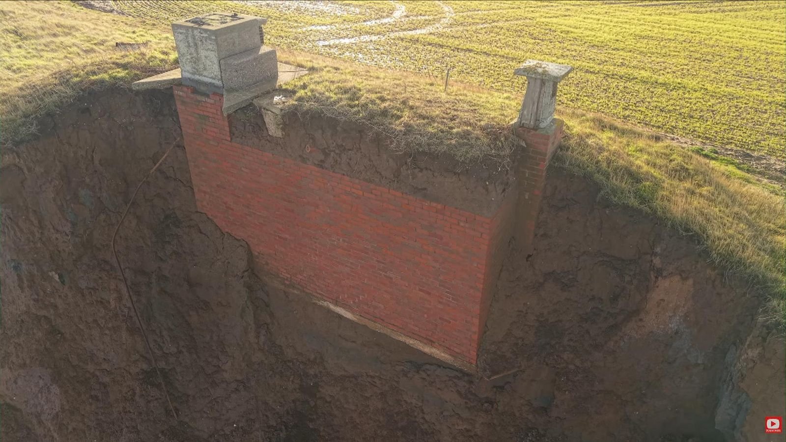 Drone footage shows the bunker hanging off the edge of the cliff. Pic: Timothy