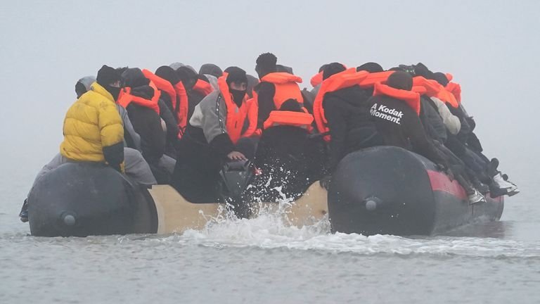 People thought to be migrants onboard a small boat in Gravelines, France. File pic: PA
